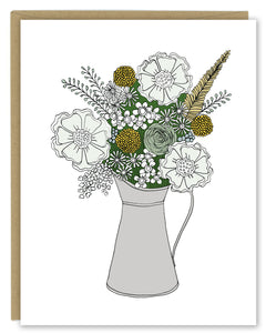 A greeting card showing a hand-drawn illustration of a bouquet of flowers in greys, greens and golds in a silver metal pitcher. Shown with a Kraft paper envelope on  a white background. 