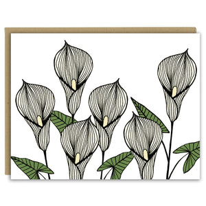 A greeting card with a hand-drawn ink illustration of six pale yellow calla lilies. Shown with a Kraft paper envelope on a white background. 