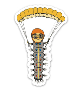 A sticker with a hand-drawn illustration of a caterpillar wearing a helmet and goggles, flying in with a parachute. Shown on a white background.