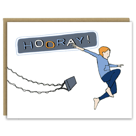 A greeting card showing a hand-drawn illustration of a red-headed boy wearing navy blue pants and a blue gray sweatshirt, arms spread wide, jumping off a high-flying swing. "Hooray!" says the land-lettered message on the card. Shown with a Kraft paper envelope on  a white background. 