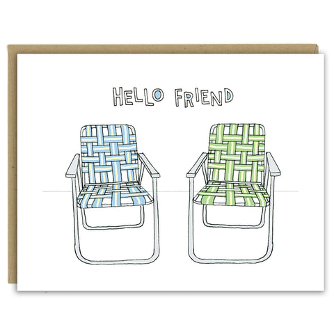 A greeting card showing a hand-drawn illustration of a pair of old-fashioned lawn chairs with webbing and metal frames, one in blues and one in greens. A hand-lettered message reads, "Hello Friend." Shown with a Kraft paper envelope on a white background. 