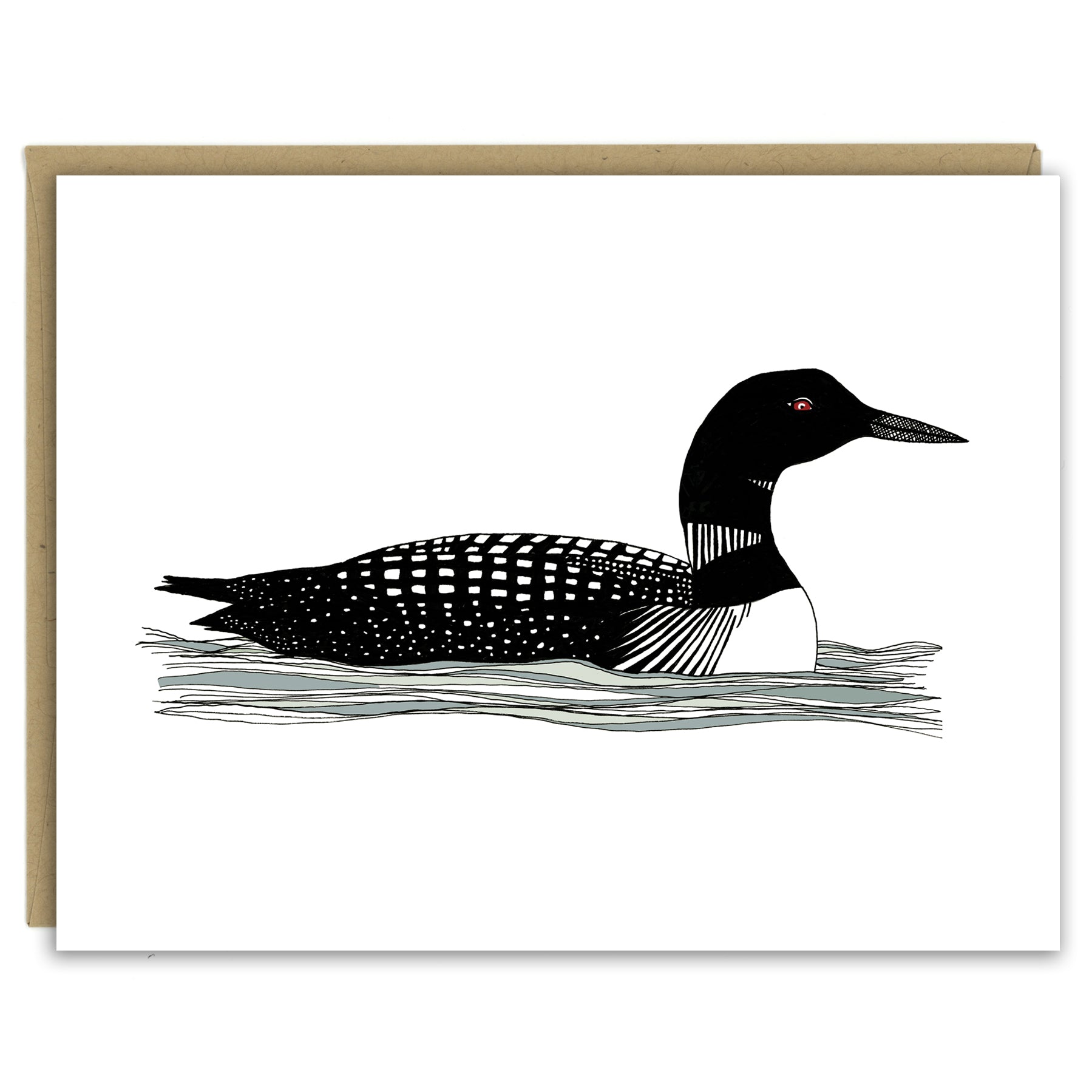 A greeting card showing a hand-drawn illustration of a black and white loon with its signature red eye, floating gently on the waves. Shown with a Kraft paper envelope on a white background. 